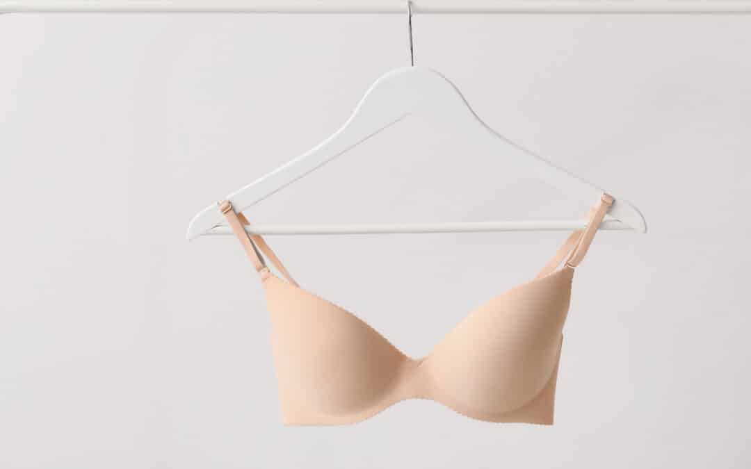 nude bra hanging on hanger